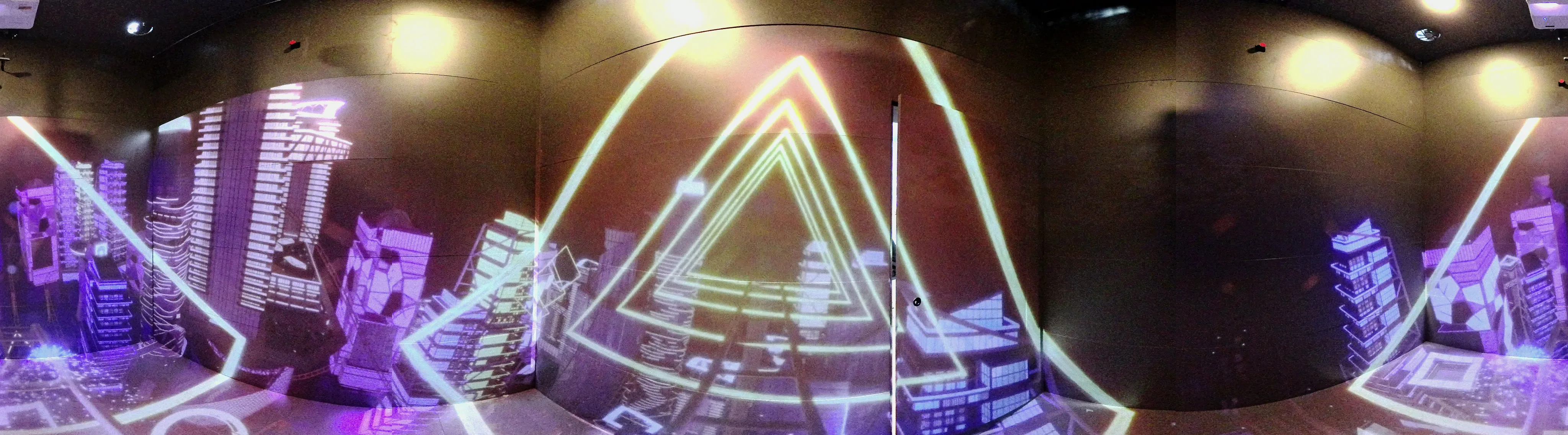 Panorama of the room: neon triangles over the city