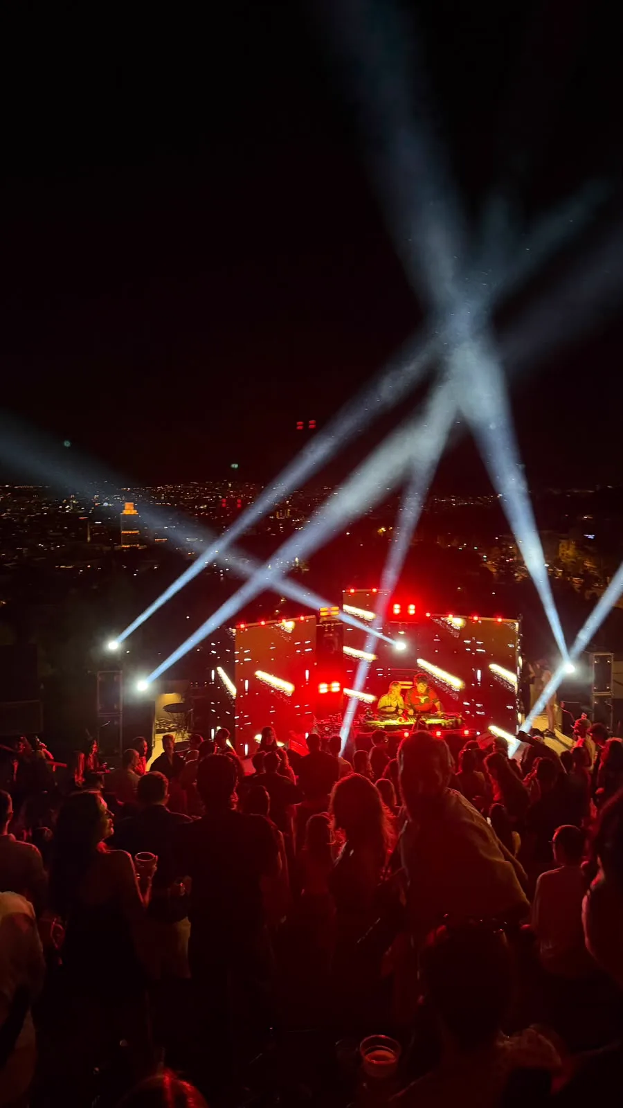 Red beams over the duo at the decks