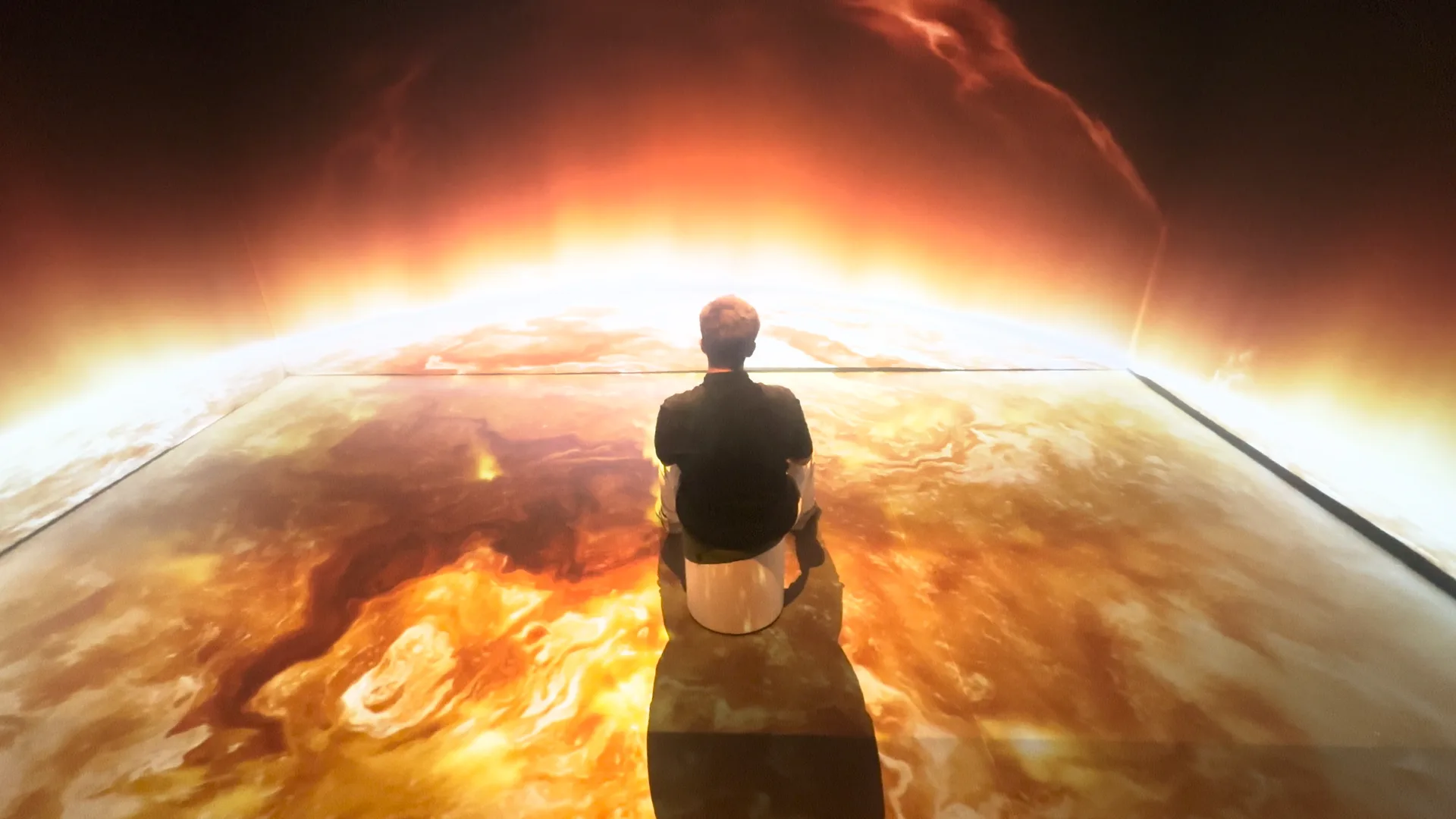 The Sun's surface projected across the walls and floor of an immersive room