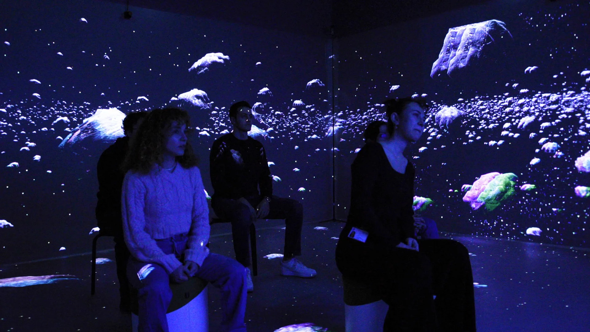 Installed: an audience seated among the ice fragments of the Neptune scene